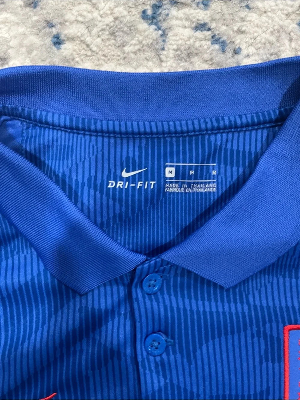 Nike England World Cup blue polo shirt with red side panels
